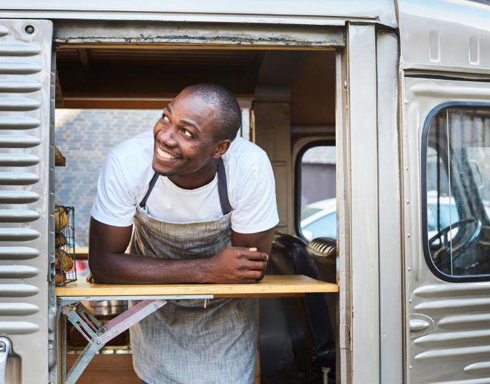 Man smiling in food truck