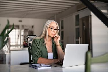 Woman looking at her laptop